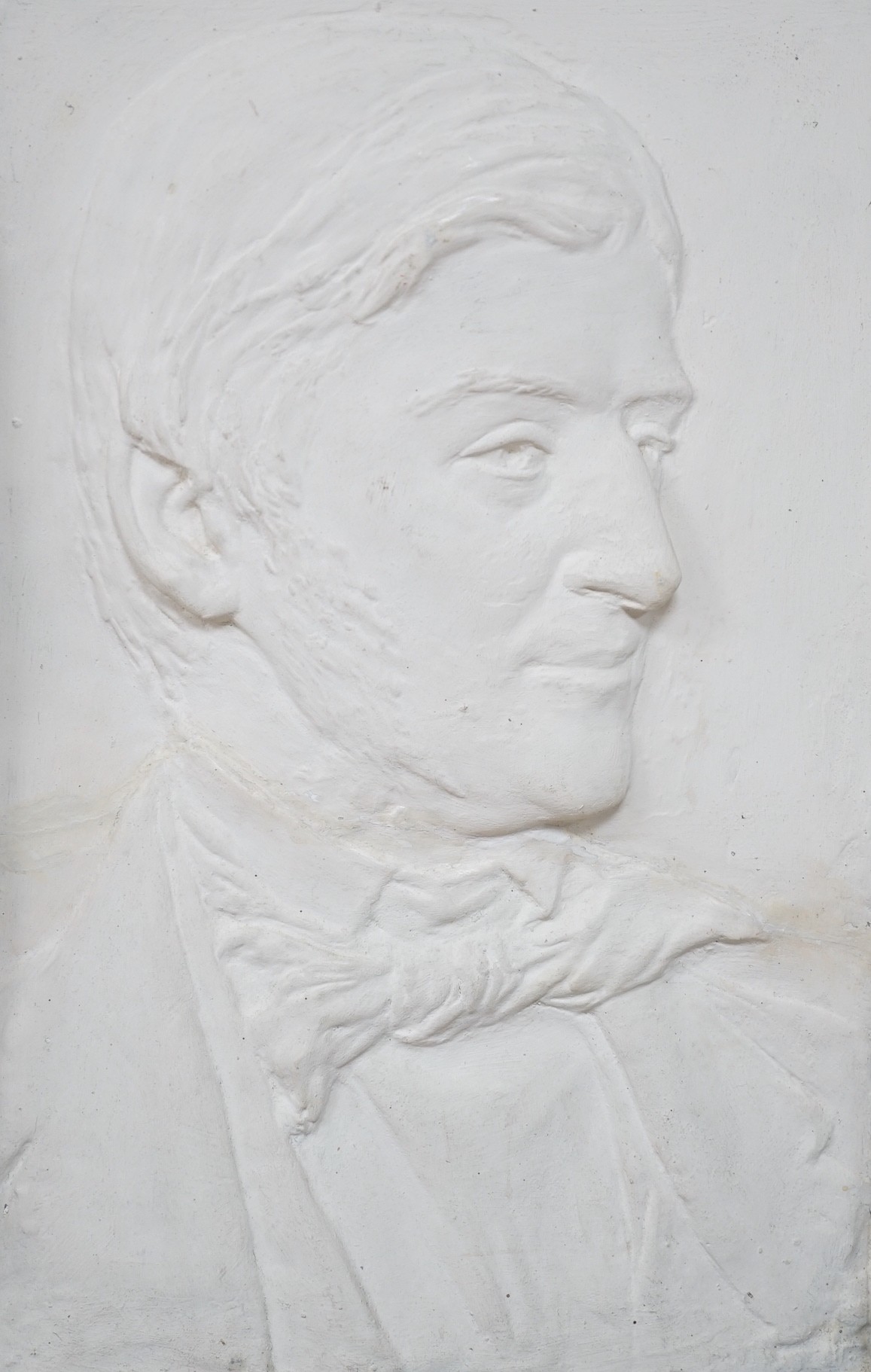 A relief moulded portrait bust, Ralph Waldo Emerson, in architectural frame, 37cms wide x 58.5cms high, including frame
